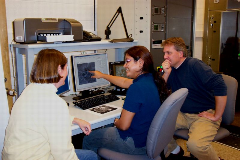 Dr Christine Floss and Maitrayee Bose studying data on the new PHI 700 Scanning Auger